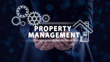 Man Demonstrating Text Property Management And Illustrations On Man demonstrating text Property Management and illustrations on dark background, closeup